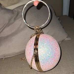 Iridescent pink glitter ball clutch